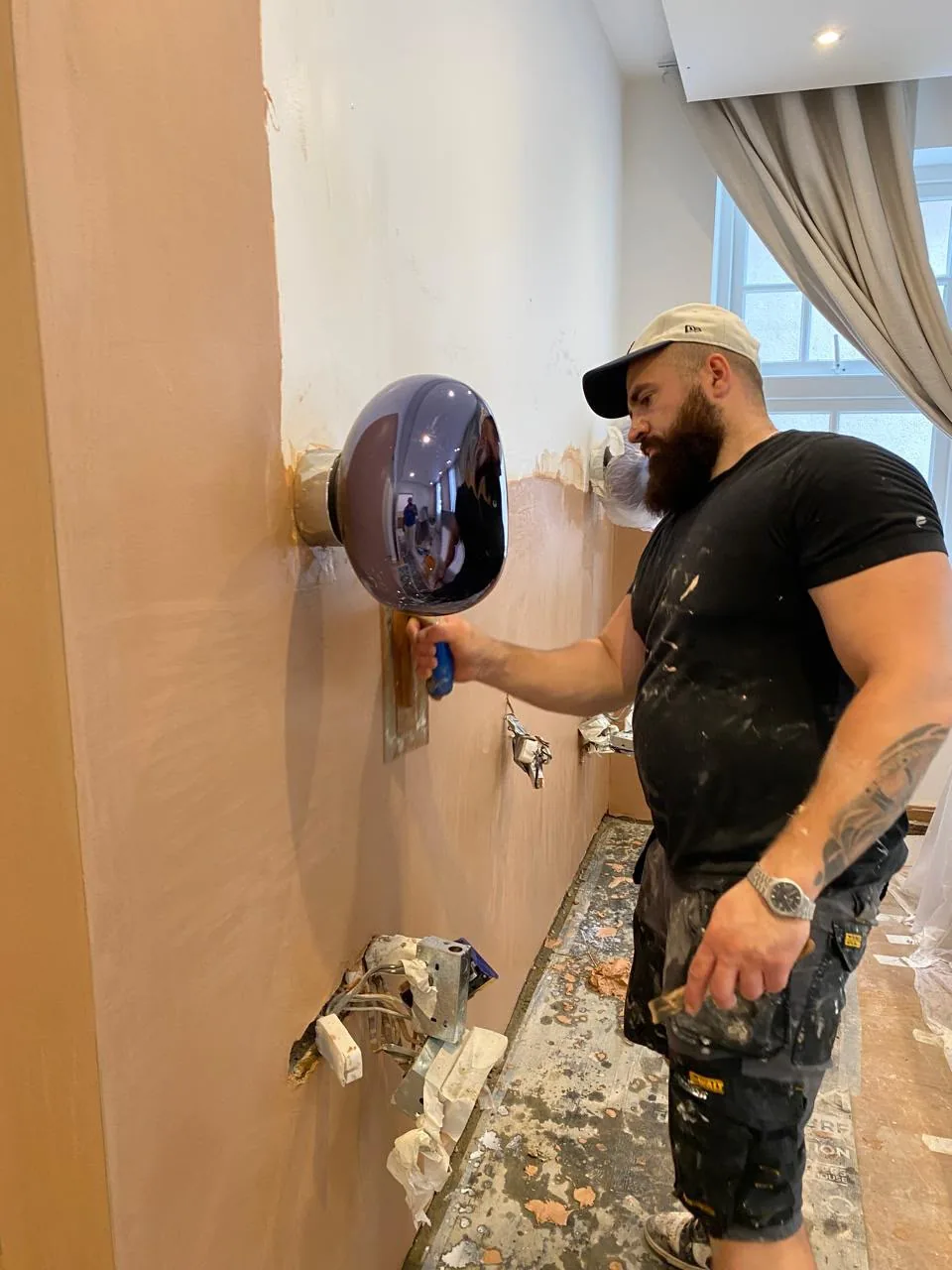 Sherifi Group operative completing specialist wall work