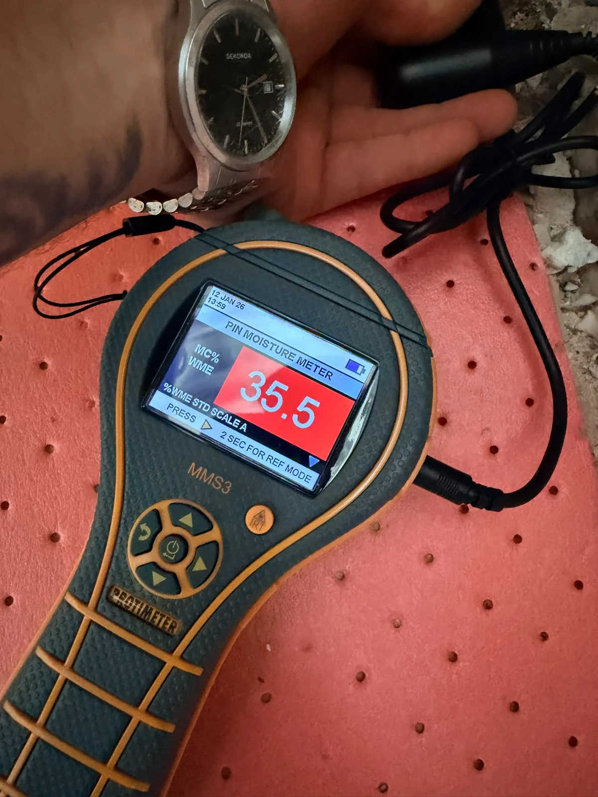 Sherifi Group moisture meter reading during a damp investigation